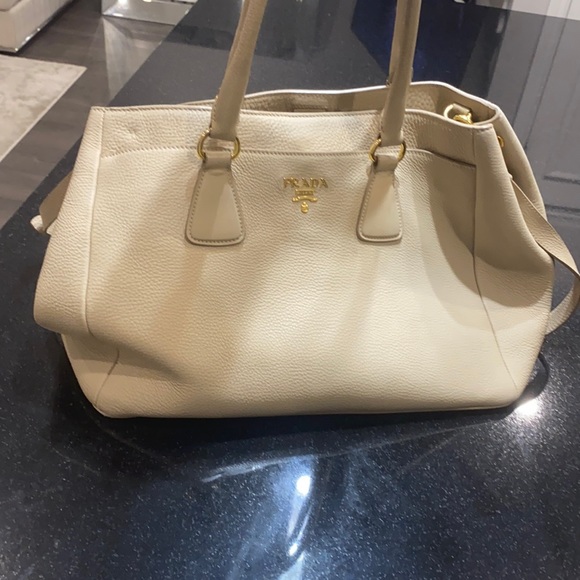 Prada Handbags - 2013 slouchy prada bag with strap and top handle.